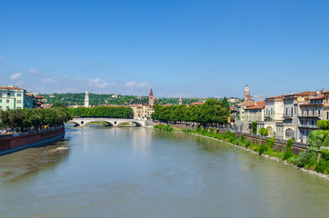 Fototapeta na wymiar View from Castelvecchio bridge towards the Vittoria bridge crossing the river Adige in Verona, Italy