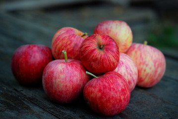 red apples on wooden table