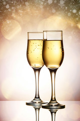Two elegant glasses with sparkling champagne