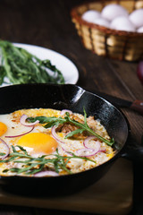 Healthy homemade cheap food, eggs and bacon in pan. Quick luncheon, home culinary