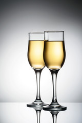 Two elegant glasses with sparkling champagne