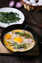 Healthy homemade cheap food, eggs and bacon in pan. Quick luncheon, home culinary