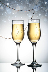 Two elegant glasses with sparkling champagne