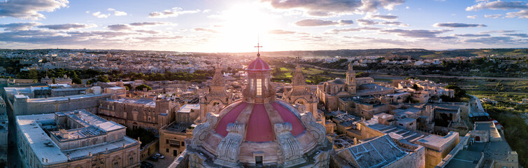 Aerial drone photo - St. Paul's Cathedral at sunset in the ancient medieval city of Mdina, Malta. - obrazy, fototapety, plakaty