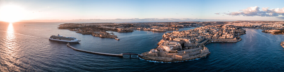Aerial drone panorama sunrise photo - Ancient capital city of Valletta Malta.  Island Country of Europe in the Mediterranean Sea - obrazy, fototapety, plakaty