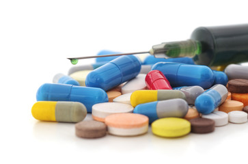 Syringe and pills.