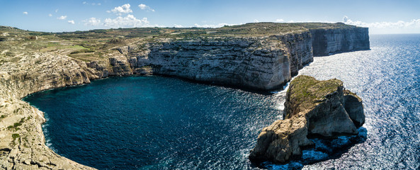 Aerial drone panorama photo - Rugged coastline of the island of Gozo, Malta