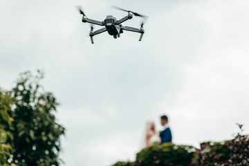 Quadcopter in the air video of the wedding