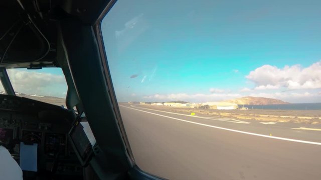 Inside view out of the cockpit of a aircraft during takeoff.