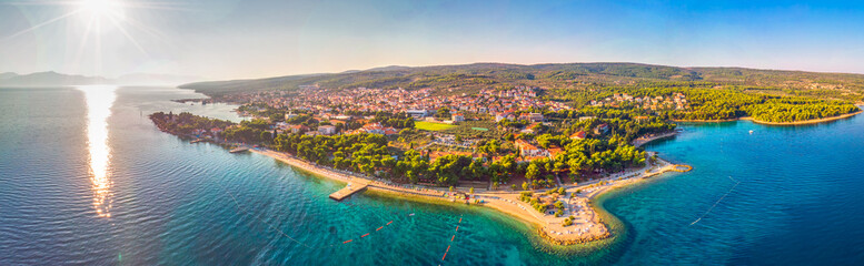 Aerial view of seaside promenade in Supetar town on Brac island with palm trees and turquoise clear...