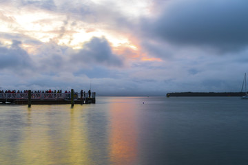 Naklejka premium Landscape Scenery of Mount Maunganui Beach, Tauranga - New Zealand; Cloudy Sunset Time