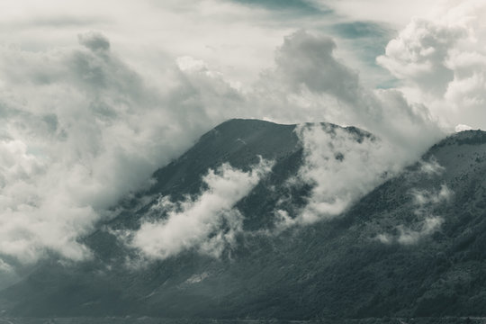 impressive mountain range covered by clouds