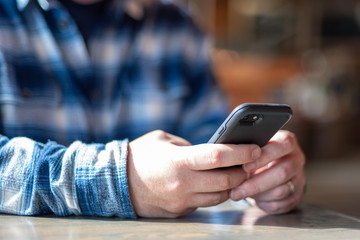 Man using cell phone - hands only