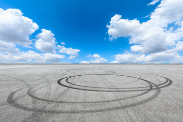 Fototapeta na wymiar Car track square and blue sky with white clouds on a sunny day