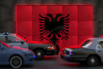 Bright digital display Albania flag in city as cars drive past