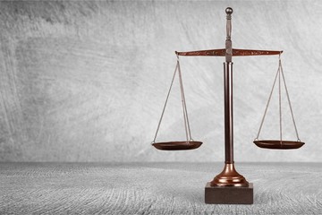 Law scales on table background. Symbol of justice