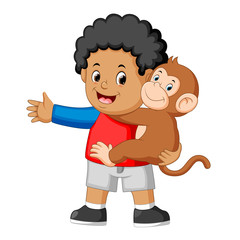 a little boy holding a funny monkey
