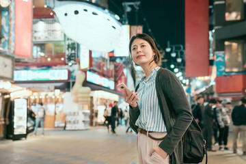 lady standing on the temming street in tsutenkaku