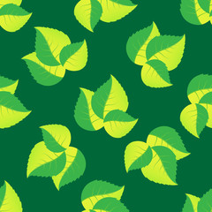 Seamless pattern of leaves arranged randomly on green background.