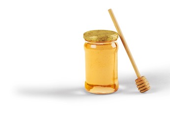 Honey and  wooden spoon  on background