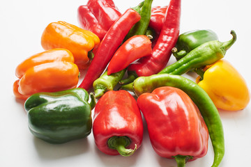 Peppers, cherry tomatoes, eggplants and dill on a white background with a copy space. Fresh multicolored vegetables..
