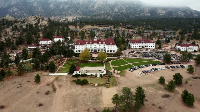 Aerial View Pulls Away From Stanley Hotel In Estes Park Colorado On Cloudy Fall Day