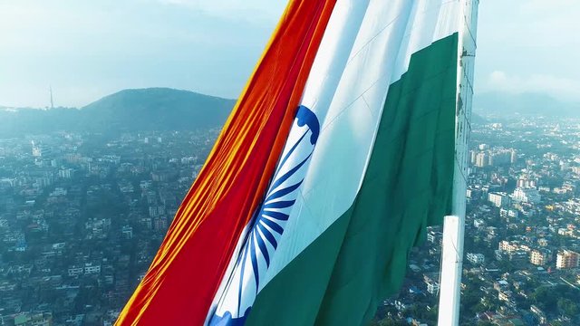 A Drone Shot of Indian National Flag revealing the city of Guwahati