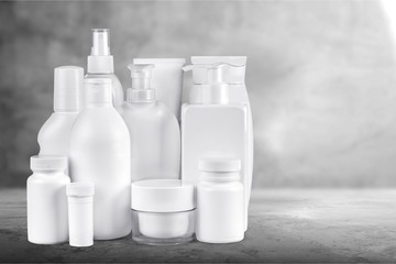 Cosmetic containers isolated on background