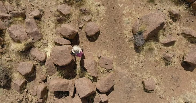 Woman photographer taking pictures, Giants Playground, Namibia, AERIAL TOP VIEW