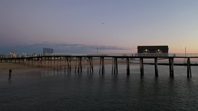 Orbiting a pier at the beach of Belmar in the early morning.