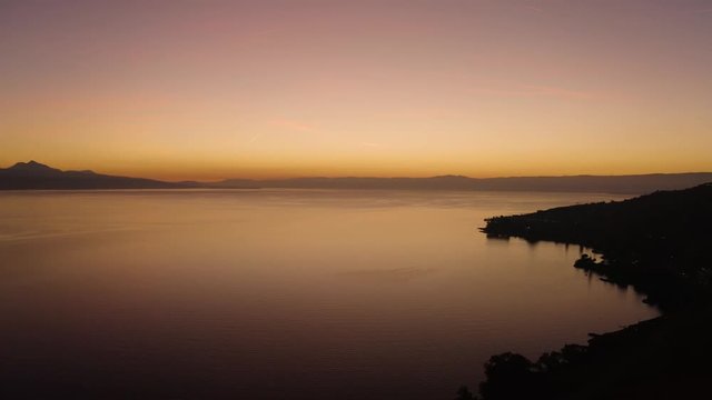 Aerial shot descending towards Lake L&radic;&copy;man with beautiful sunset colors
Cully, Vaud - Switzerland
