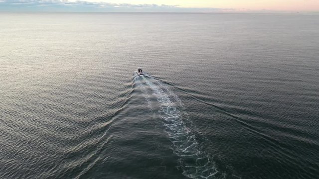 Flying over a boat near the beach of Belmar New Jersey in the early morning.
