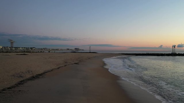 Drone flies backwards and films a seagull at Belmar, New Jersey.