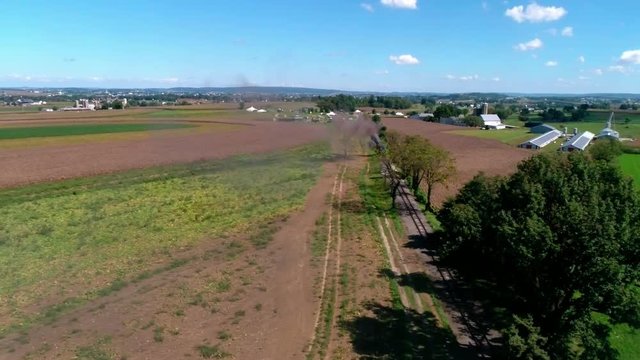 Thomas the Train with Passenger Cars Puffing along Amish Countryside