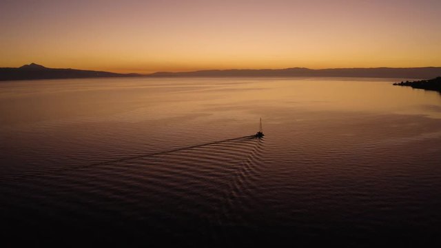 Aerial shot overtaking sailboat on Lake L&radic;&copy;man with beautiful sunset colors
In front of Cully, Lavaux - Switzerland