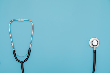 Black Stethoscope on blue background