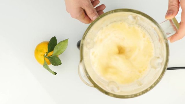 preparation of a fruit cocktail in a blender, smoothies. Top view. Fitness and healthy lifestyle concept. 4K