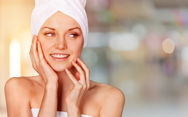 Young beautiful healthy woman with white towel