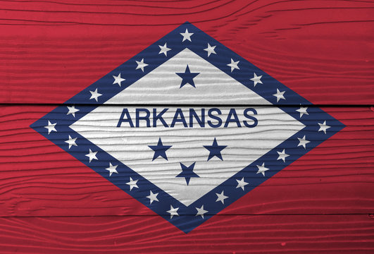 Flag of Arkansas on wooden wall background. Grunge Arkansas flag texture, The states of America.