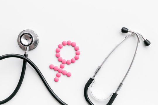 Female diseases concept. Stethoscope near female sign on white background top view