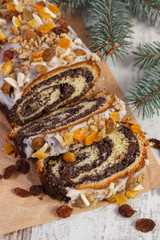 Obraz na płótnie Canvas Homemade poppy seeds cake and spruce branches, concept of dessert for Christmas