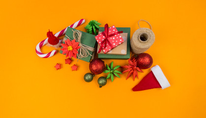 Packed gifts with a bow on an orange background