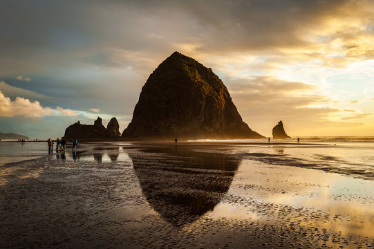 Haystack Rock on Cannon Beach in Oregon at sunset.