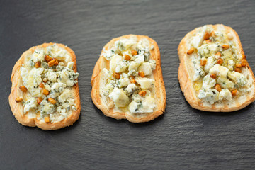 Sandwich, grilled baguette with blue cheese, honey and pine nuts