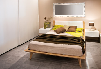 Modern bedroom with wooden Scandinavian style bed