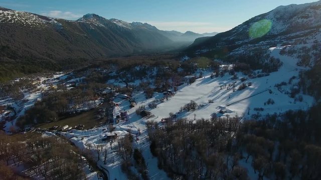 Ski town mountain range sunset during winter season in Chillan, south Chile.