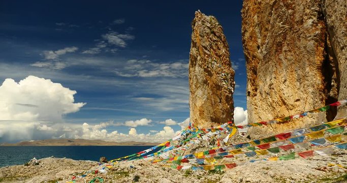 4k Prayer flags at the lake namtso in tibet,ancient holy monk meditation in cave,ZhaXi Peninsula,tibet mansarovar,Tibet's second largest lake,is the third largest saltwater lake in China,