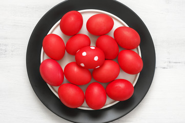 Red Easter eggs in plate
