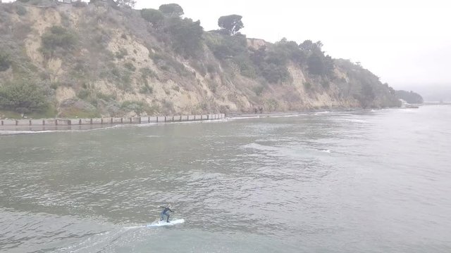 Begnning Surfer Riding Slow Wave Near Bolinas, CA. Falling Off Board