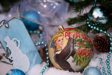 Christmas Decorations: Balls, fir branches, ribbons, straw toys and postcards